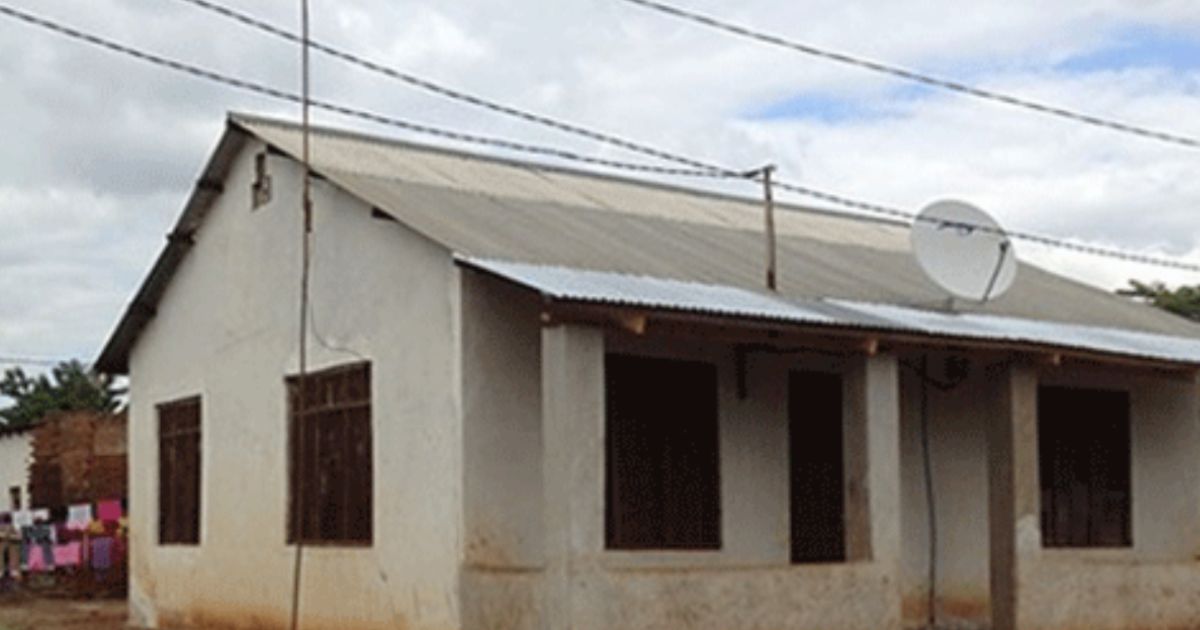 A house in Tanzania with electric lines running overhead